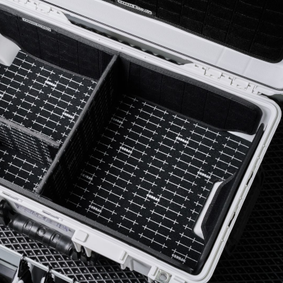 Open hard case with a machined compartment layout (illustrative photo)